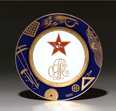 A Soviet propaganda porcelain plate, by the Imperial Porcelain Factory, period of Nicholas II, 1897, with later blue overglaze State Porcelain Factory jubilee mark of cog, V, hammer and sickle, dated 1922, numbered 21515. After a design by Mikhail Adamovich. Diameter 9½ in (24.3 cm). Sold for £50,400 on 30 November 2005 at Christie’s in London