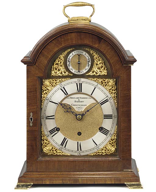 An English mahogany and brassmounted quarterchiming table clock, last