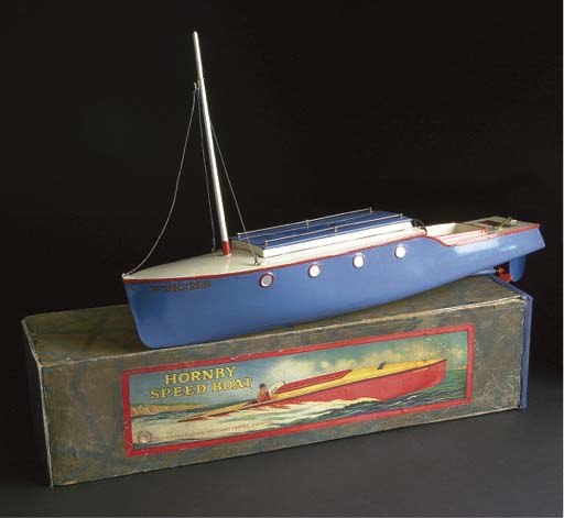 A Boxed Clock-work Hornby Speed Boat Named Racer III in Blue and White