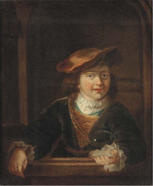 A boy in a cap wearing a gold chain holding a bubble, at a casement 
