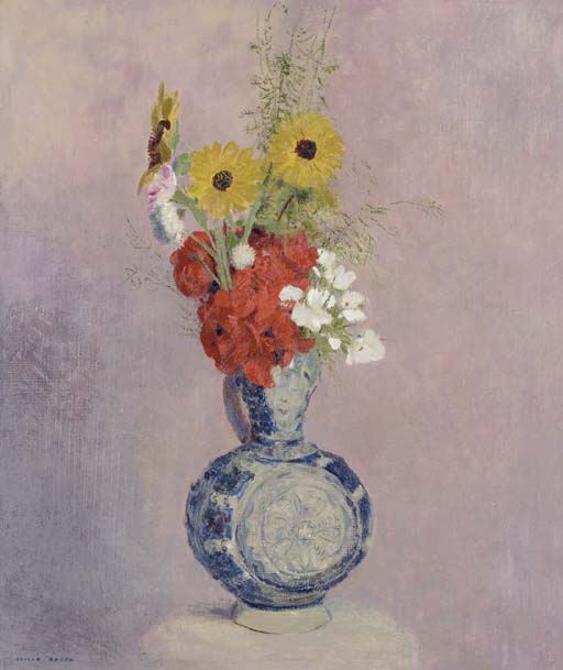 Bouquet de fleurs dans un vase bleu 
