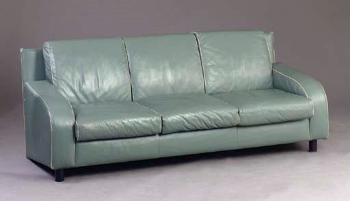 A BLUE-GREEN LEATHER UPHOLSTERED SOFA WITH IVORY PIPING,