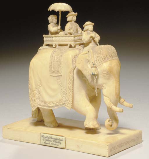 AN INDIAN IVORY CARVING OF HIS HIGHNESS OF BENGAL ATOP AN ELEPHANT