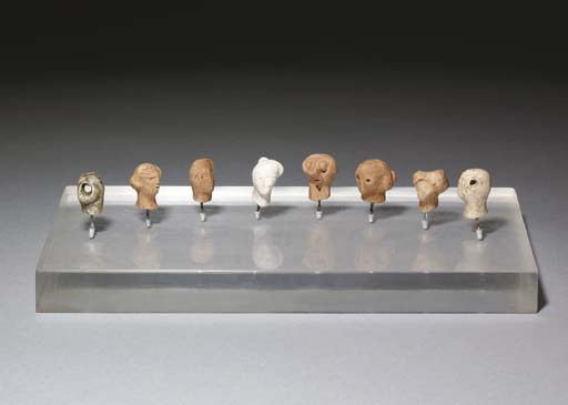 Eight plaster heads 
