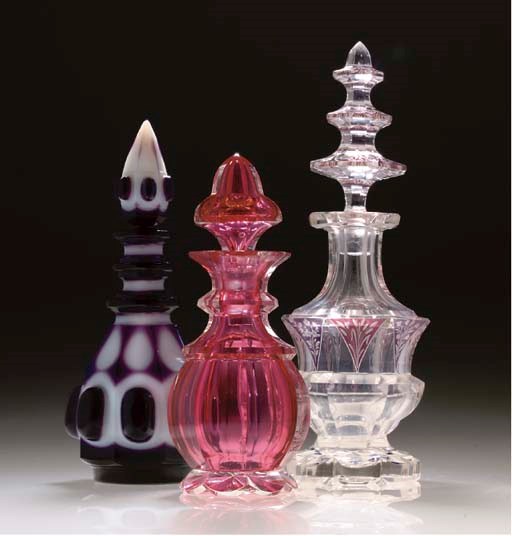 A BOHEMIAN PALE RUBY FLASH FLASK AND STOPPER AND TWO OTHERS