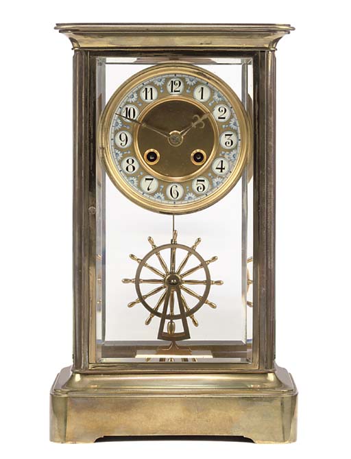 A French brass striking fourglass mantel clock with ship's wheel