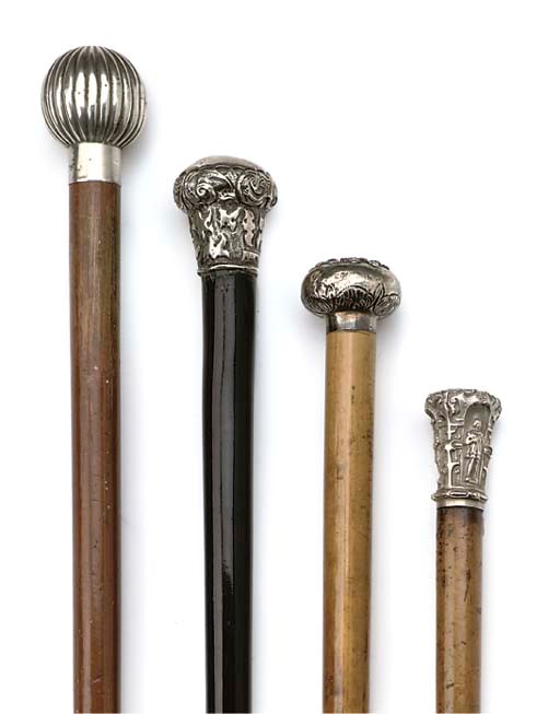 A COLLECTION OF FOUR SILVER MOUNTED WALKING STICKS