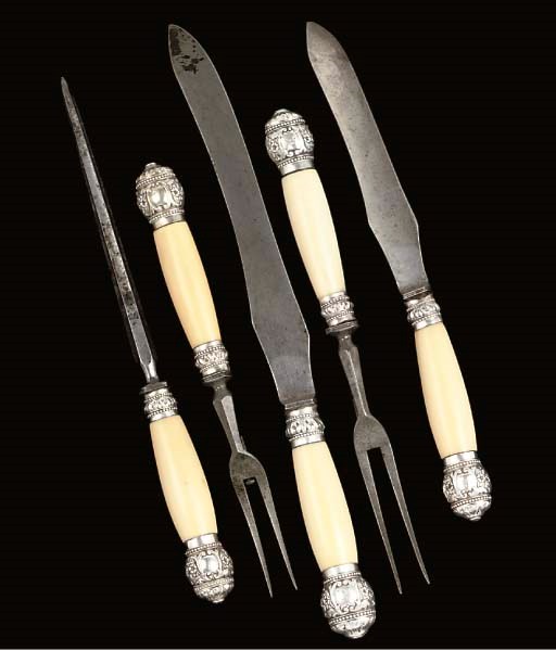 A FIVEPIECE IVORY HANDLED CARVING SET WITH SILVER MOUNTS , SHEFFIELD
