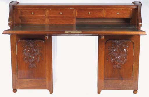 AN ART NOUVEAU MAHOGANY FALL FRONT PARTNER'S DESK,