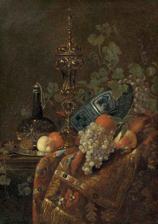 Oranges in a Wanli 'kraak porselein' bowl, a peach and nuts on a silver plate, a glass vessel of wine, a gilt cup and cover and white and black grapes, all on a partially draped table
