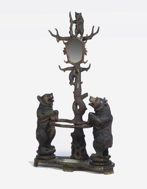 A SWISS BLACK FORREST CARVED WOOD BEAR COAT RACK AND UMBRELLA STAND