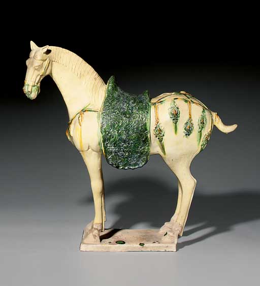 A LARGE SANCAI GLAZED POTTERY FIGURE OF A HORSE , TANG DYNASTY (618