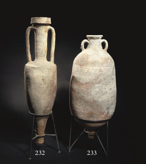 A ROMAN POTTERY WINE AMPHORA , MID 2ND CENTURY B.C./1ST CENTURY B.C