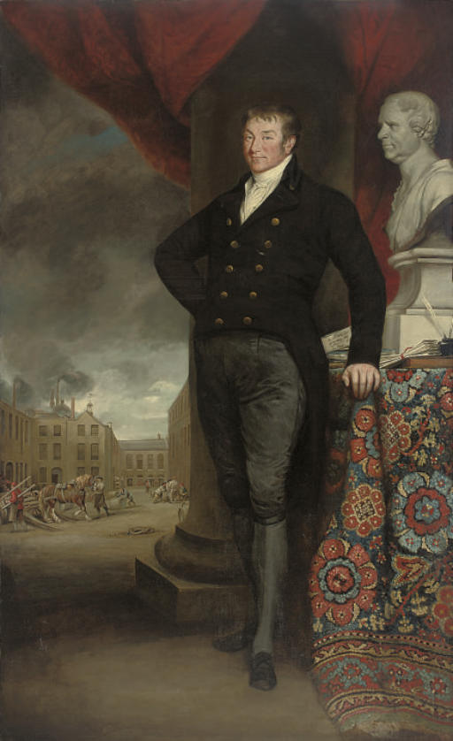 Portrait of a gentleman, full-length, in a black coat and breeches, standing by a column and a draped table with a bust of the sitter and documents inscribed 'A plan for/bettering the/condition of/the poor', a work-house courtyard beyond
