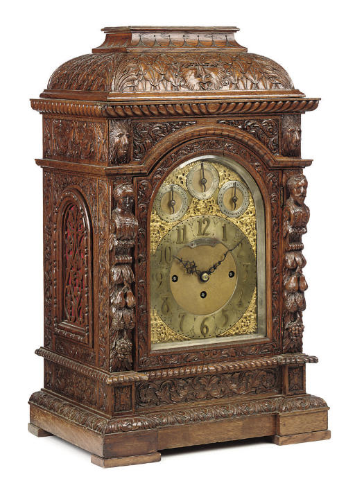 A Victorian oak eight day quarter chiming table clock , ARNOLD AND LEWIS, MANCHESTER. LATE 19TH