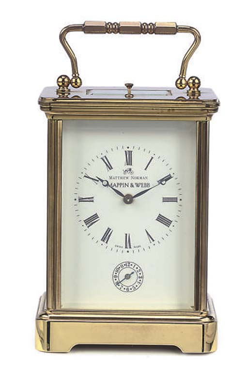 A SWISS BRASS CARRIAGE CLOCK , BY MATTHEW NORMAN, RETAILED BY MAPPIN