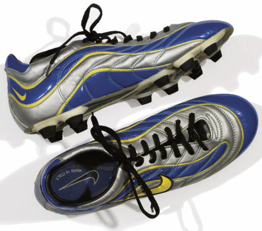 grey and yellow nike boots