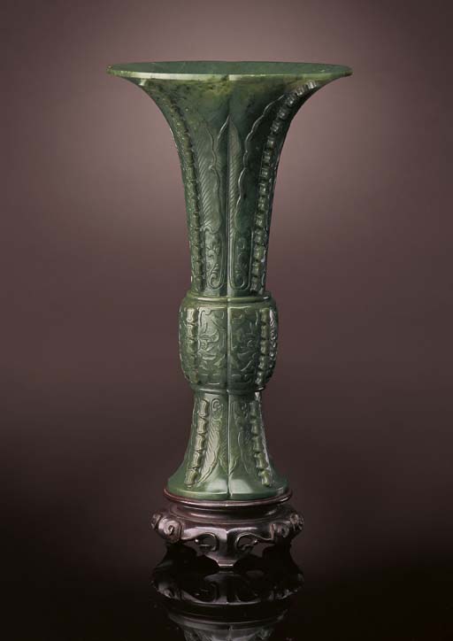 A FINELY CARVED SMALL JADEITE VASE AND COVER,