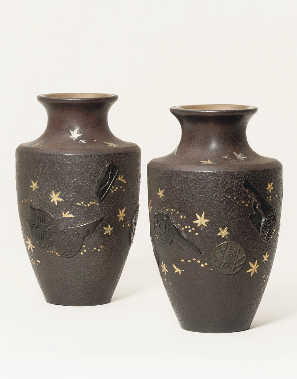 A pair of iron vases
