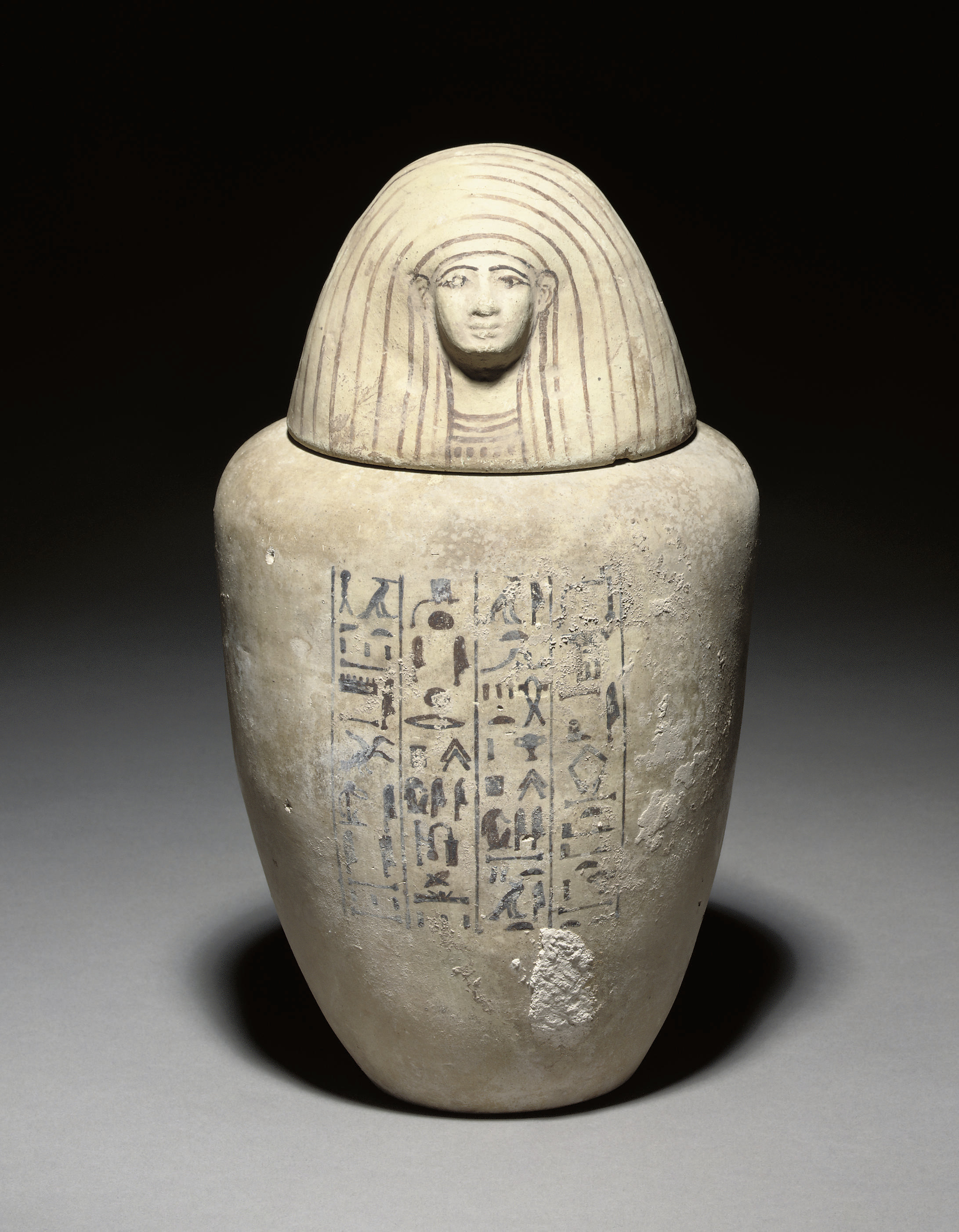 AN EGYPTIAN POTTERY HUMANHEADED CANOPIC JAR OF PAIYNEN