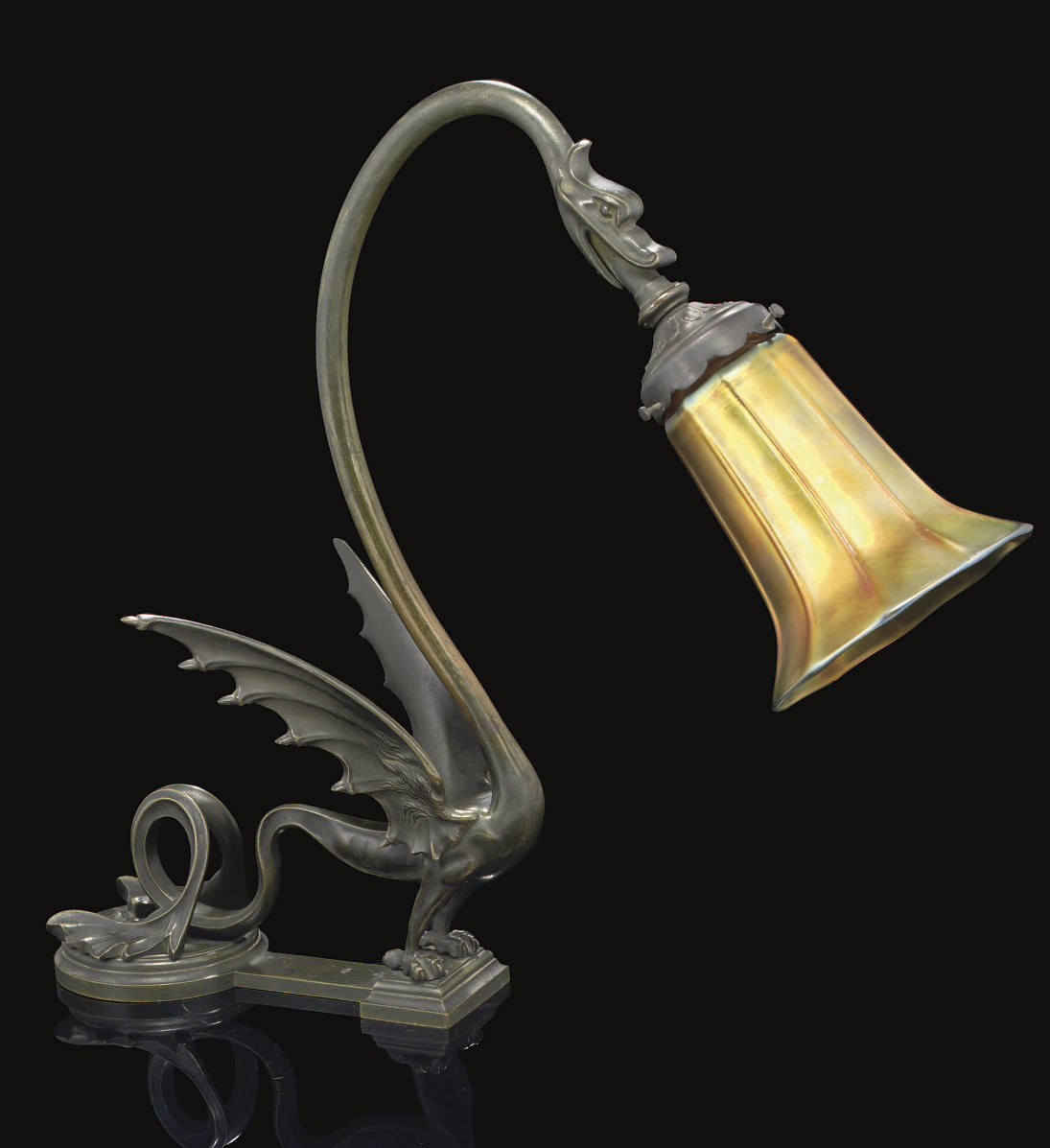 QUEZAL , A PATINATED BRONZE 'DRAGON' TABLE LAMP WITH IRIDESCENT GLASS