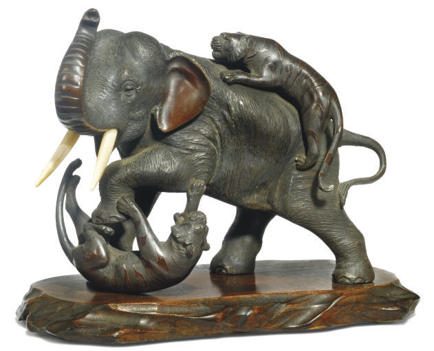 A JAPANESE BRONZE GROUP OF AN ELEPHANT AND TIGERS, BY SEIYA , MEIJI