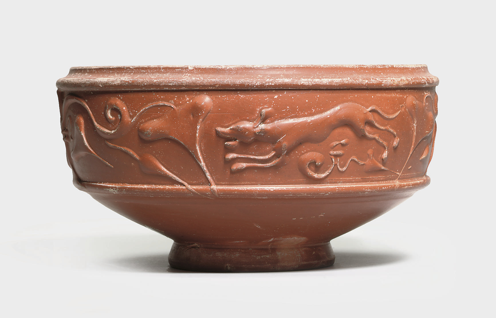 A ROMAN  RED WARE POTTERY BOWL CIRCA 2ND CENTURY A D 