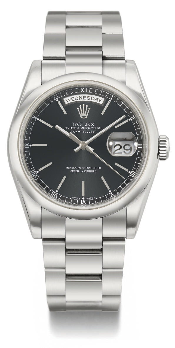 Rolex. An 18K white gold automatic calendar wristwatch with sweep