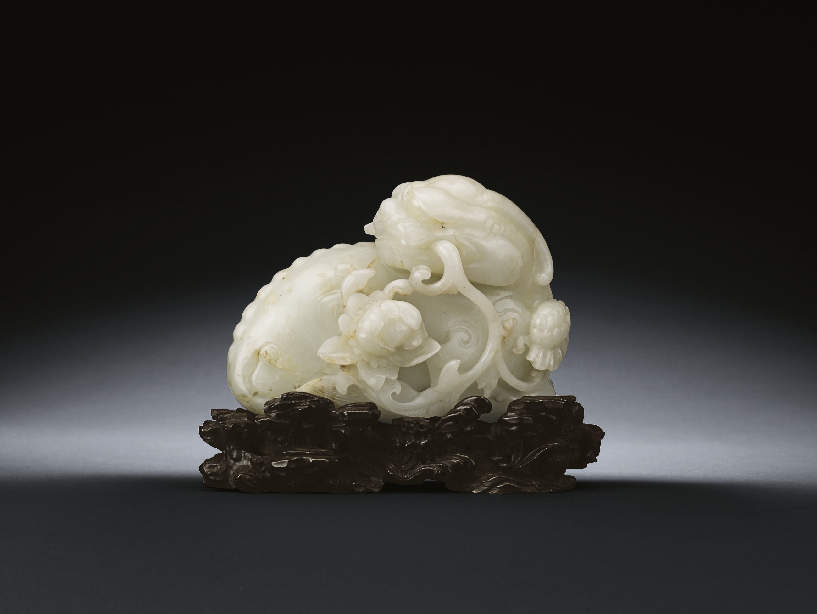 A WELLCARVED JADE CARVING OF A BUDDHIST LION Christie's