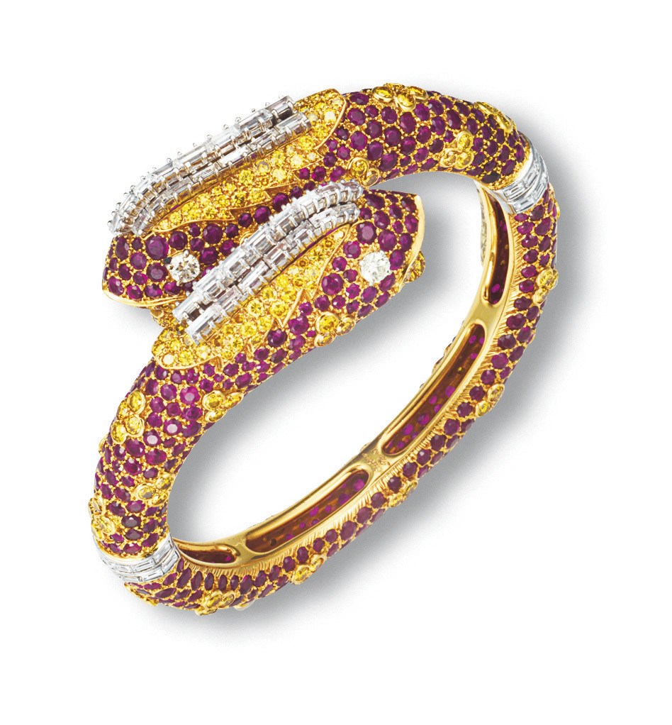 AN UNUSUAL RUBY, COLOURED DIAMOND AND DIAMOND 'CHIMAERA' BANGLE, BY ...