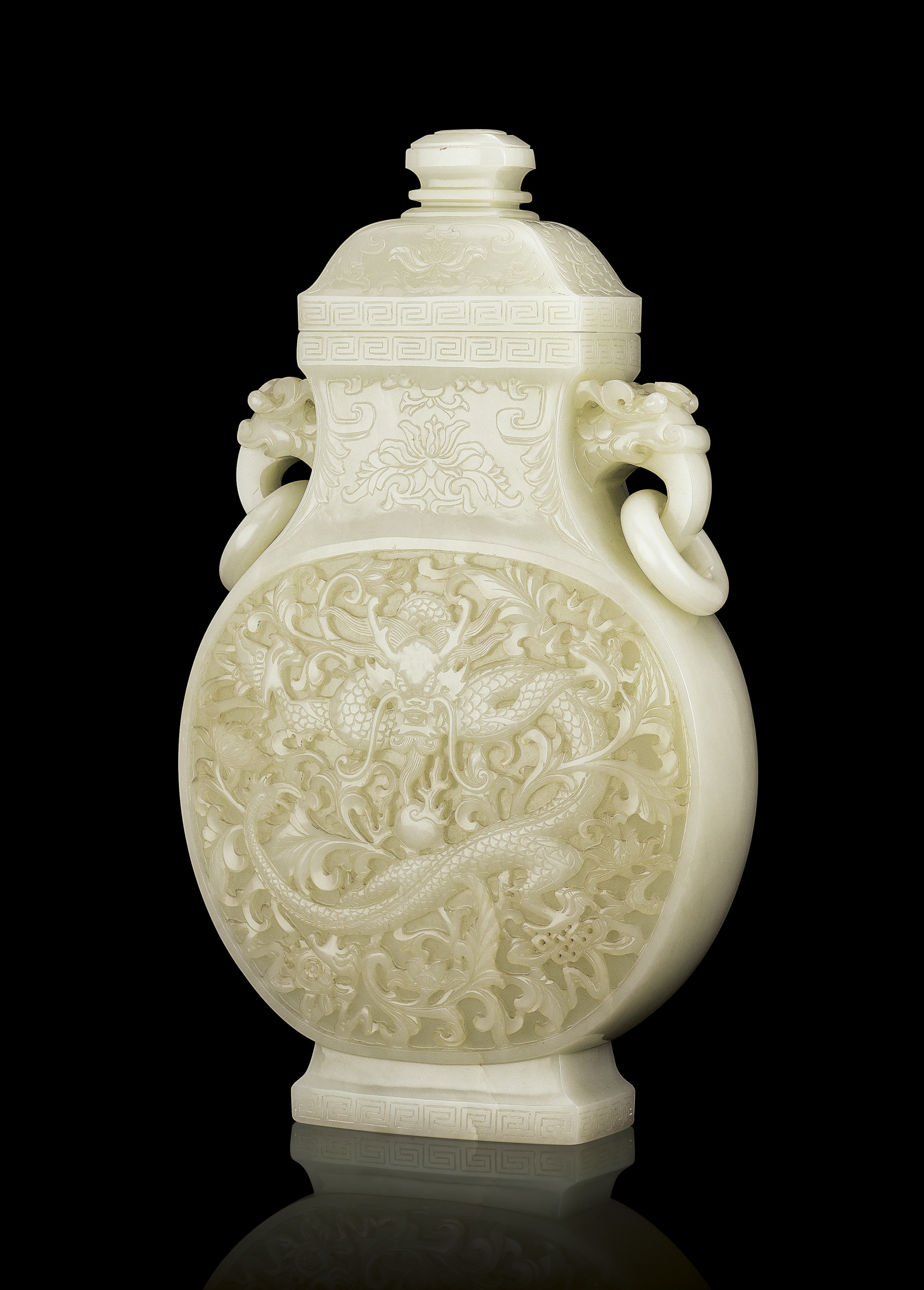A MAGNIFICENT IMPERIAL WHITE JADE 'DRAGON' VASE AND COVER Christie's