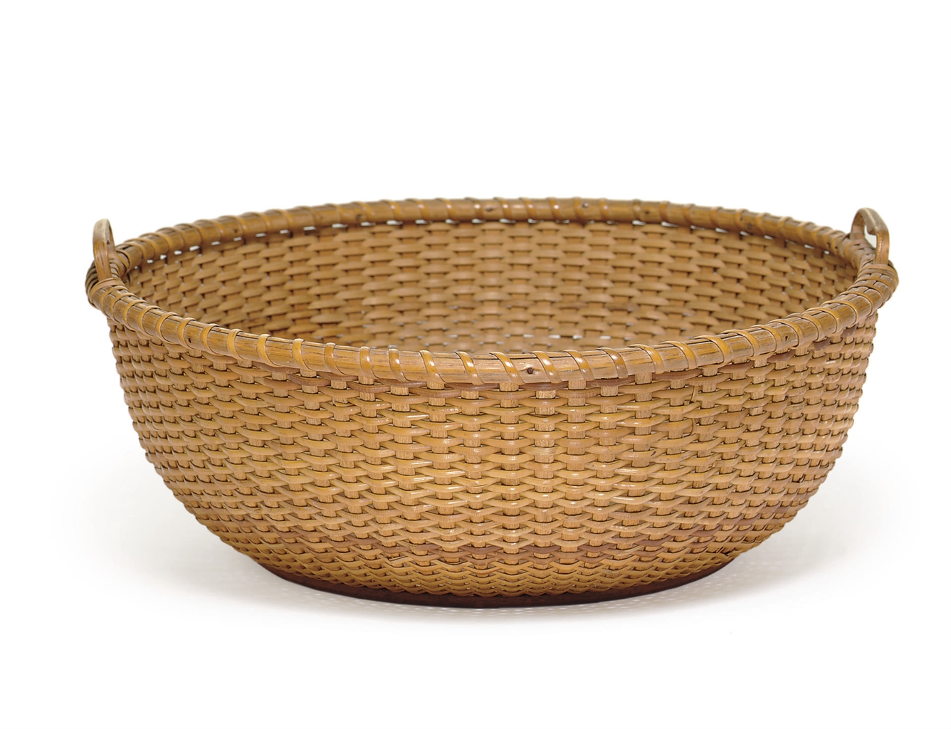 A WOVEN OPEN BASKET