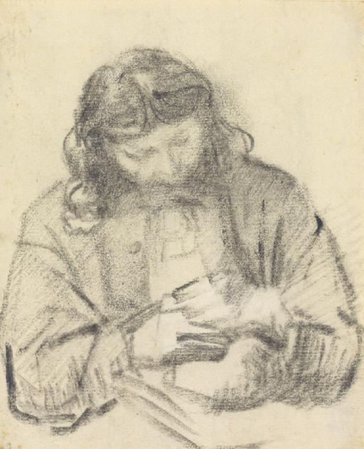 Seated man, half length, at work 
