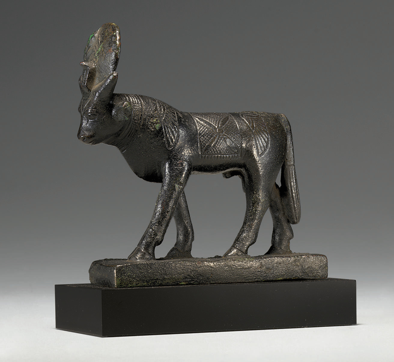AN EGYPTIAN BRONZE APIS BULL , LATE PERIOD TO PTOLEMAIC PERIOD, 66430