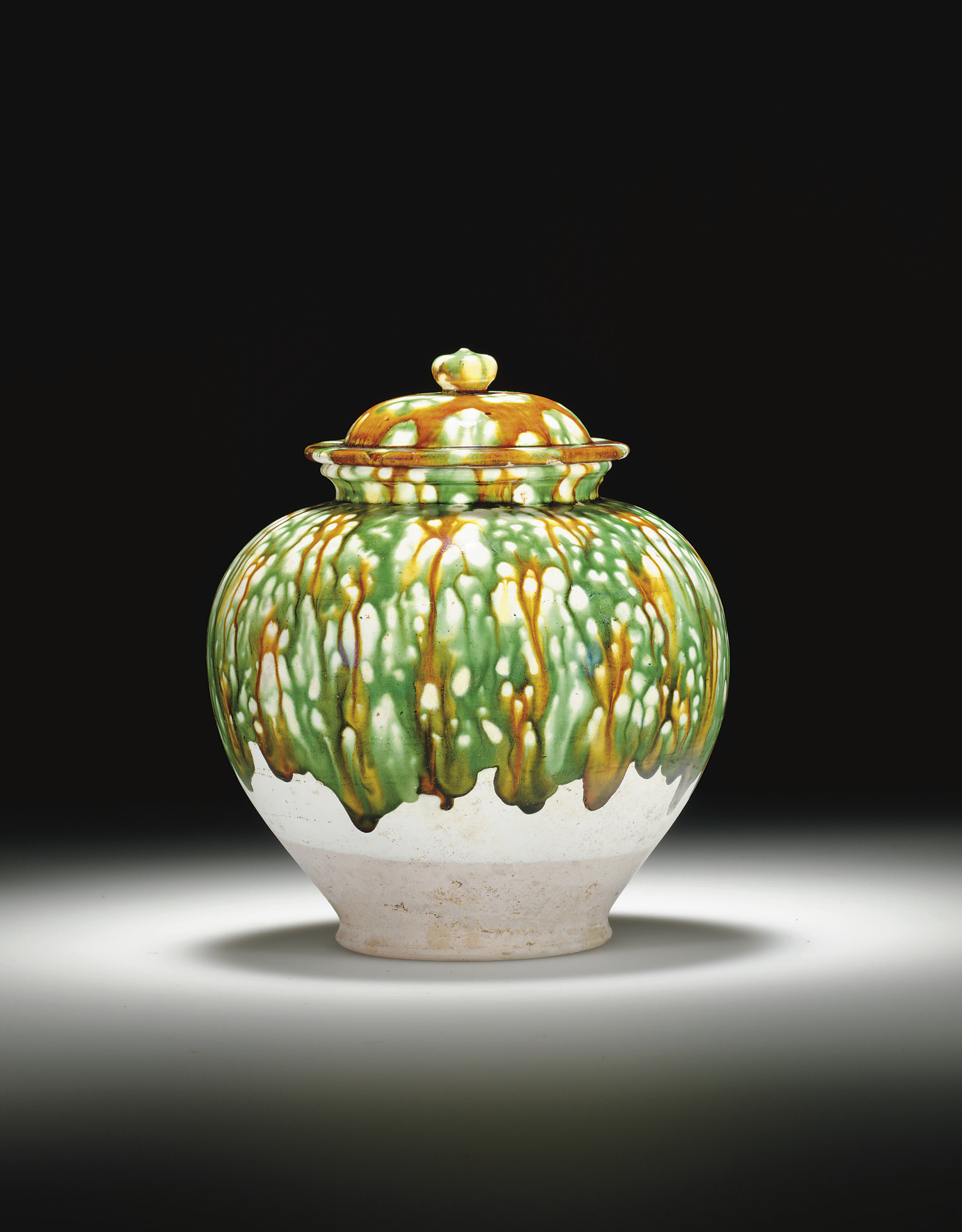 A SANCAIGLAZED POTTERY JAR AND COVER , TANG DYNASTY (618907) Christie's