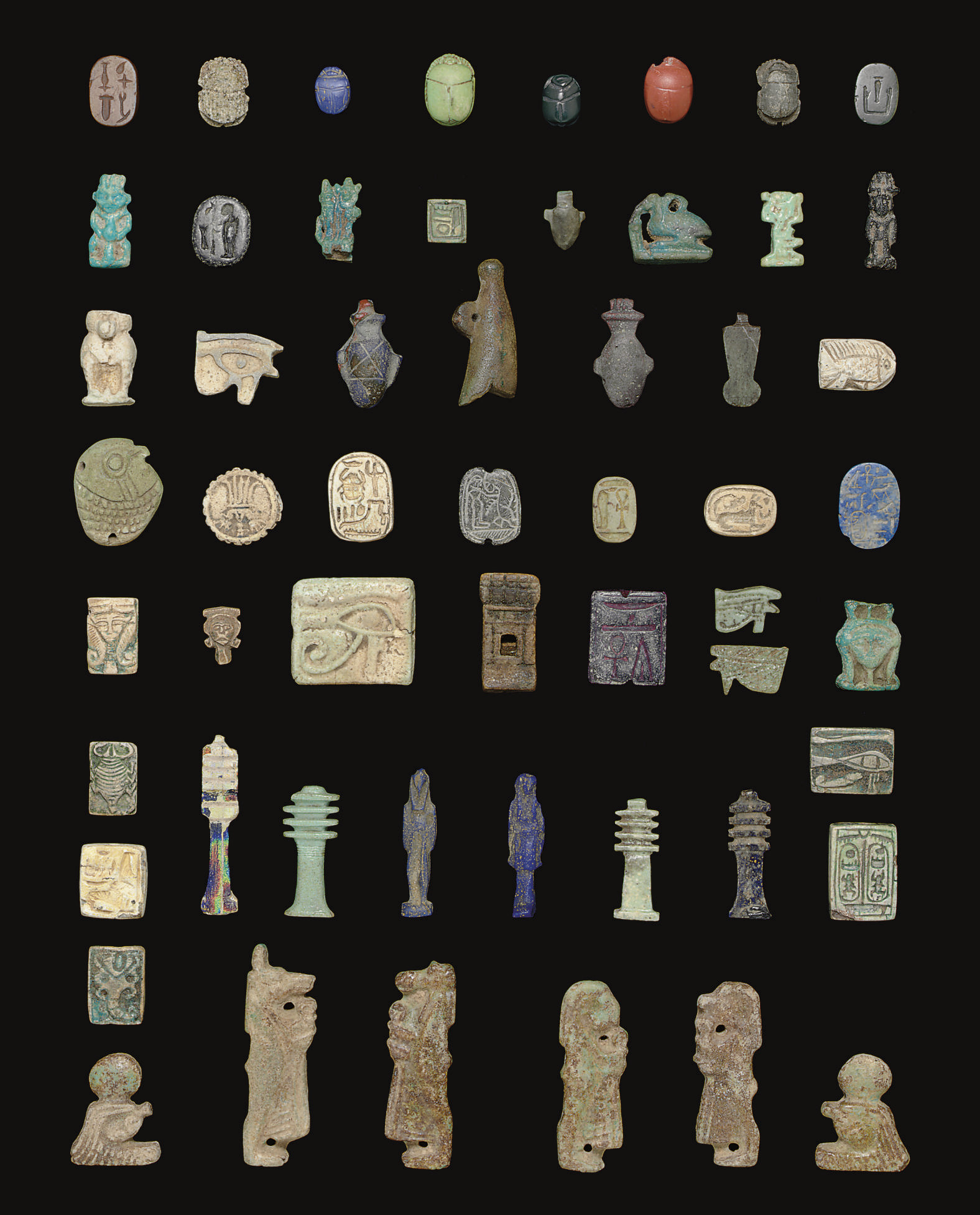 A GROUP OF EGYPTIAN SCARABS AND AMULETS , PHARAONIC TO ROMAN, AND LATER