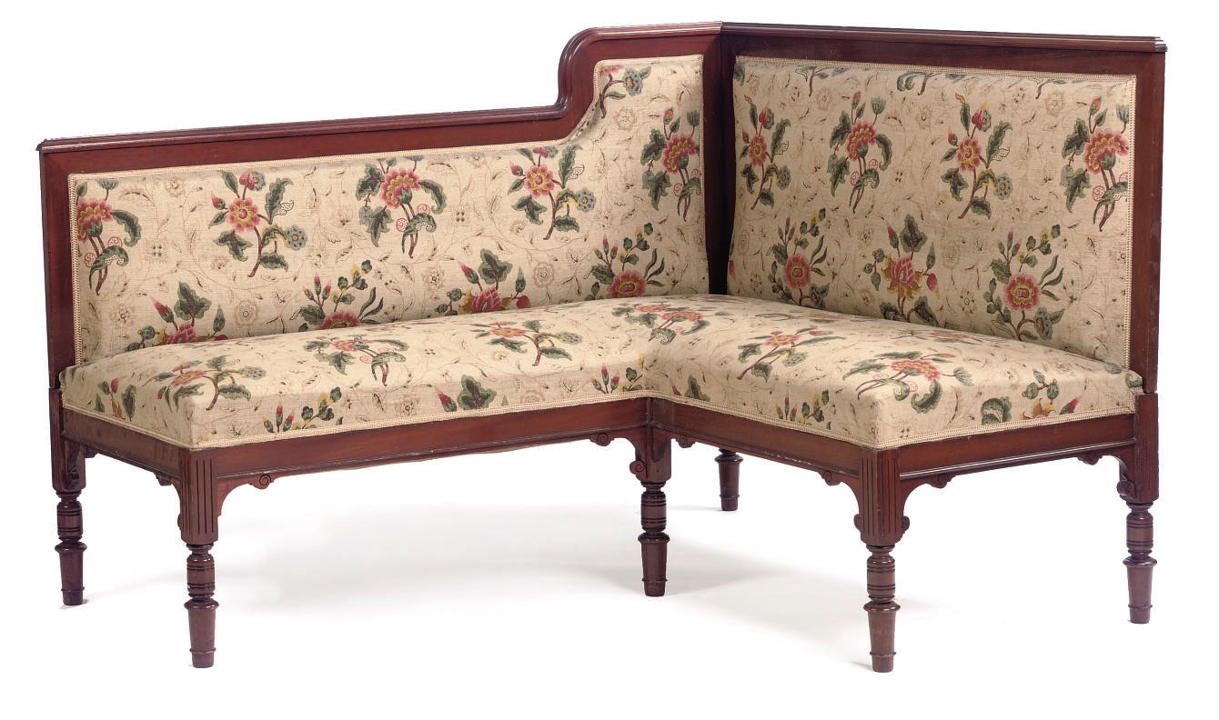 A GERMAN MAHOGANY CORNER SETTEE