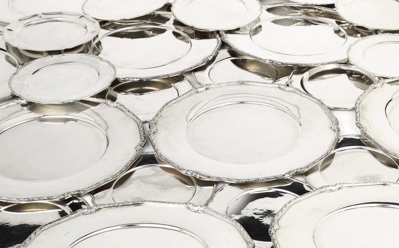 A set of twelve Mexican silver dinner plates, twelve sideplates and