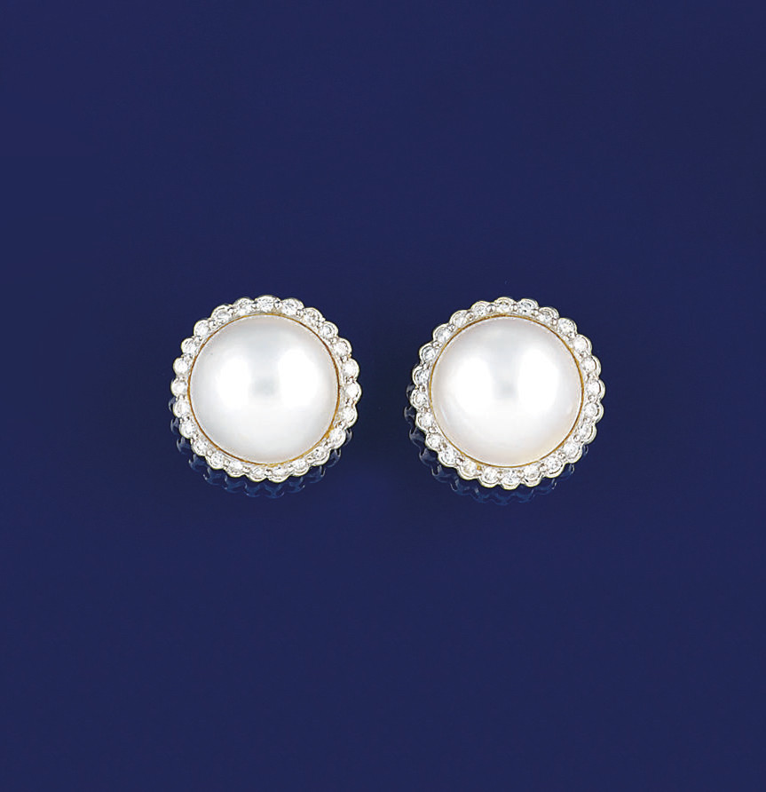A PAIR OF MABÉ CULTURED PEARL AND DIAMOND EARCLIPS A PAIR OF MABÉ CULTURED PEARL AND DIAMOND EARCLIPS 
