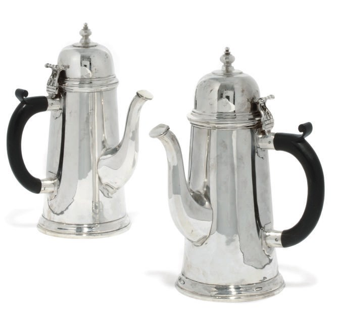 A MATCHED PAIR OF SILVER COFFEE POTS IN THE QUEEN ANNE STYLE , MAKER'S
