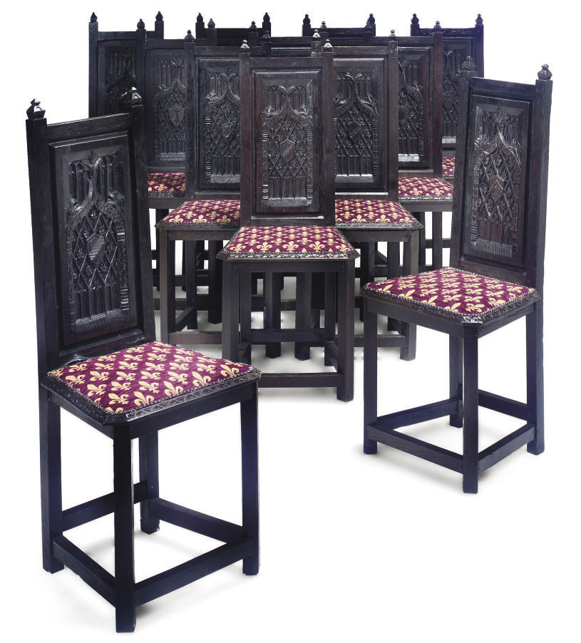 A SET OF TWELVE BLACKPAINTED DININGCHAIRS , OF GOTHIC REVIVAL STYLE