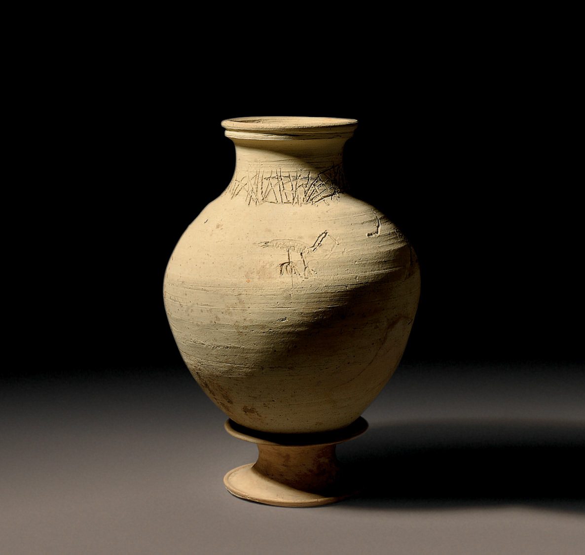 A SYRIAN POTTERY JAR WITH INCISED DECORATION , MIDDLE BRONZE AGE, CIRCA
