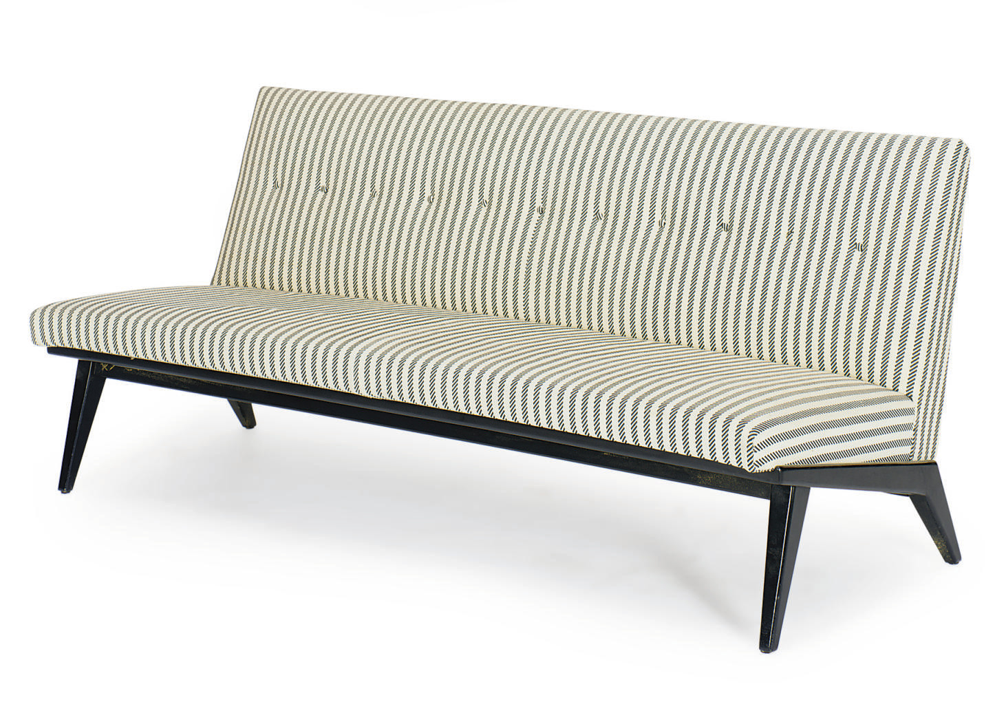 A BLACK AND WHITE UPHOLSTERED AND EBONIZED SOFA,