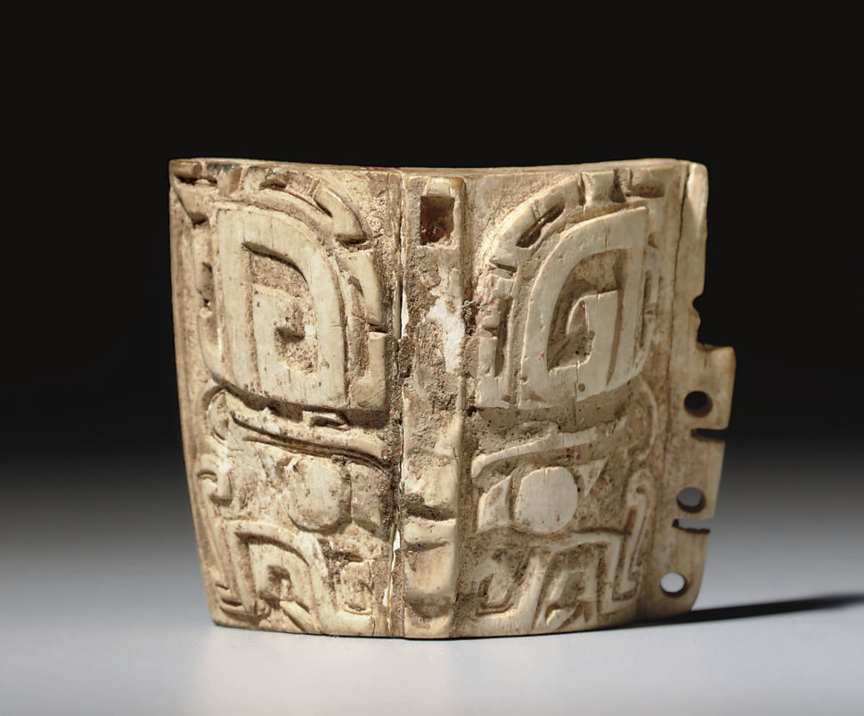 **A RARE IVORY TAOTIE MASK FITTING , SHANG DYNASTY, ANYANG, 12TH11TH