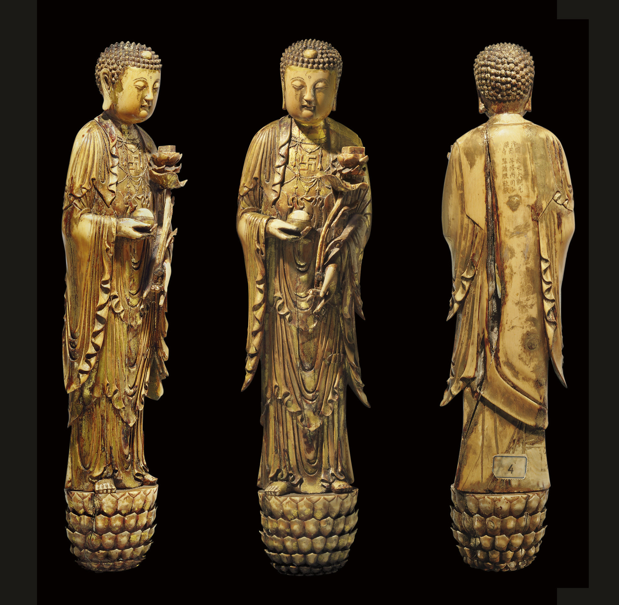 *A VERY RARE AND IMPORTANT LARGE GILDED IVORY FIGURE OF BUDDHA , LATE