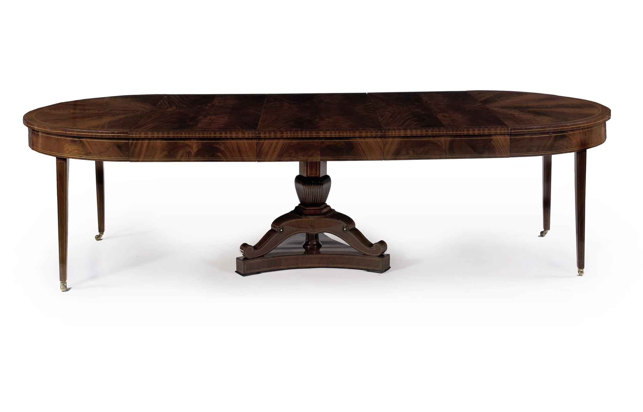 A German Biedermeier Mahogany And Maple Extending Dining Table