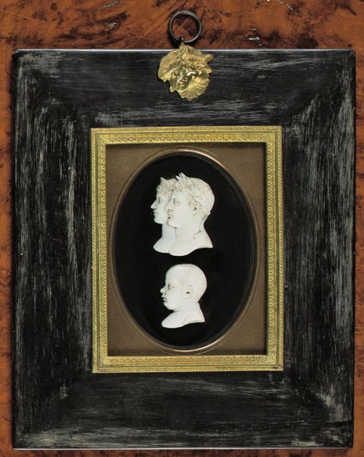 A SET OF THREE CARVED IVORY RELIEF PORTRAITS OF EMPEROR NAPOLEON