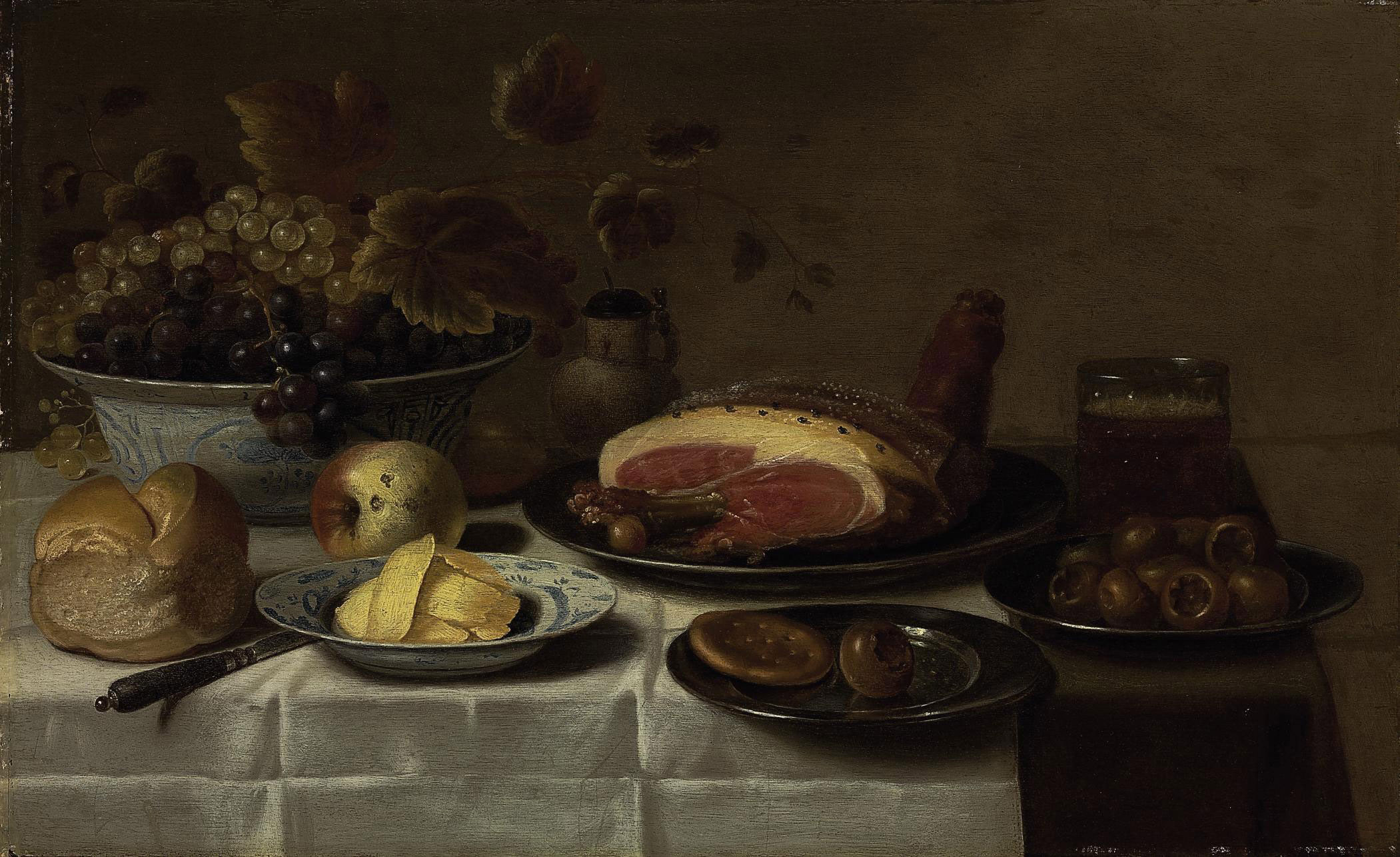 Floris Van Schooten C 1580 8 1656 Haarlem White And Blue Grapes In A Kraak Porcelain Bowl A Loaf Of Bread A Knife Butter On A Porcelain Plate A Biscuit And Medlar