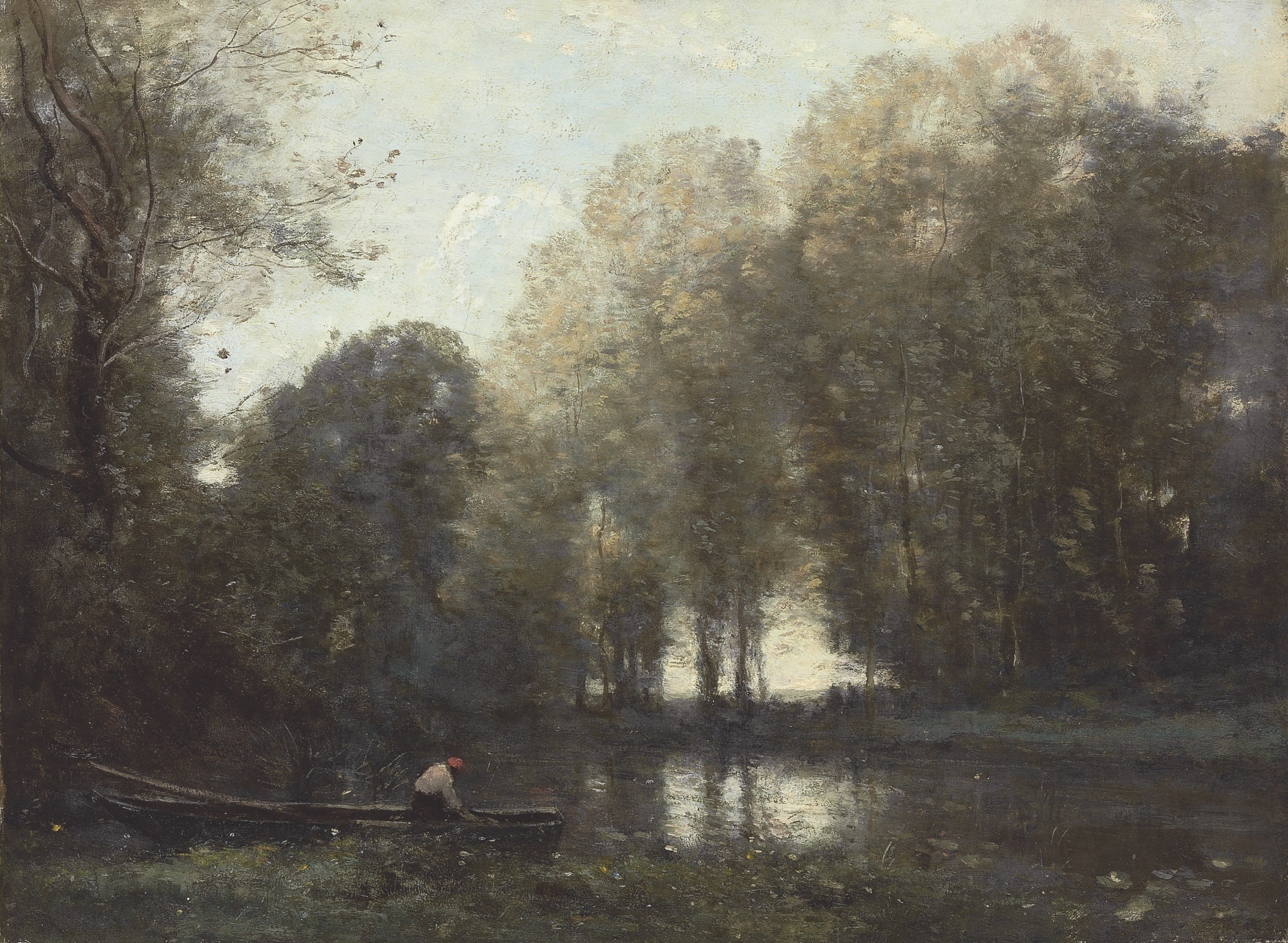 Pêcheur amarré sur la rive verte 
