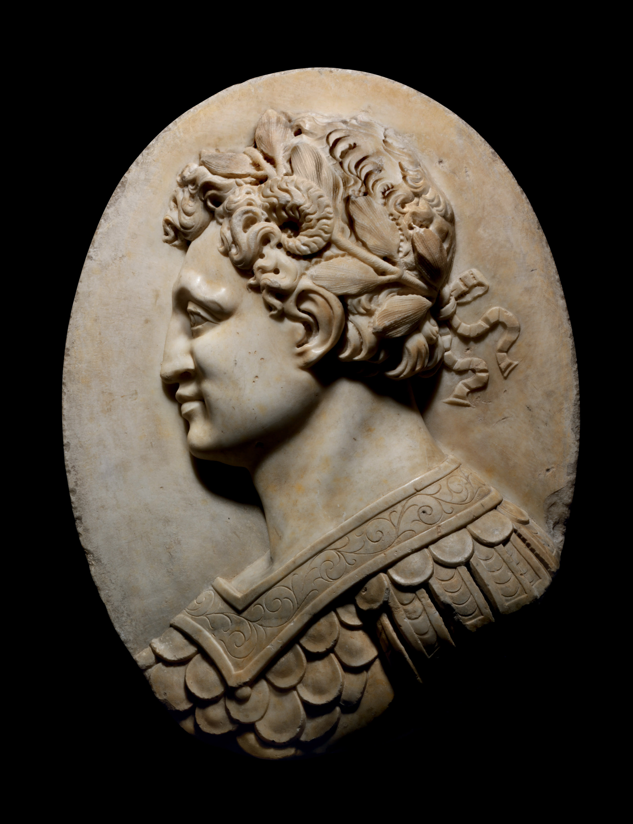 AN OVAL CARVED MARBLE PROFILE PORTRAIT RELIEF OF ALEXANDER THE GREAT AS